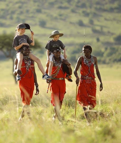 children doing a walking safari with masai warriors in masai mara kenya